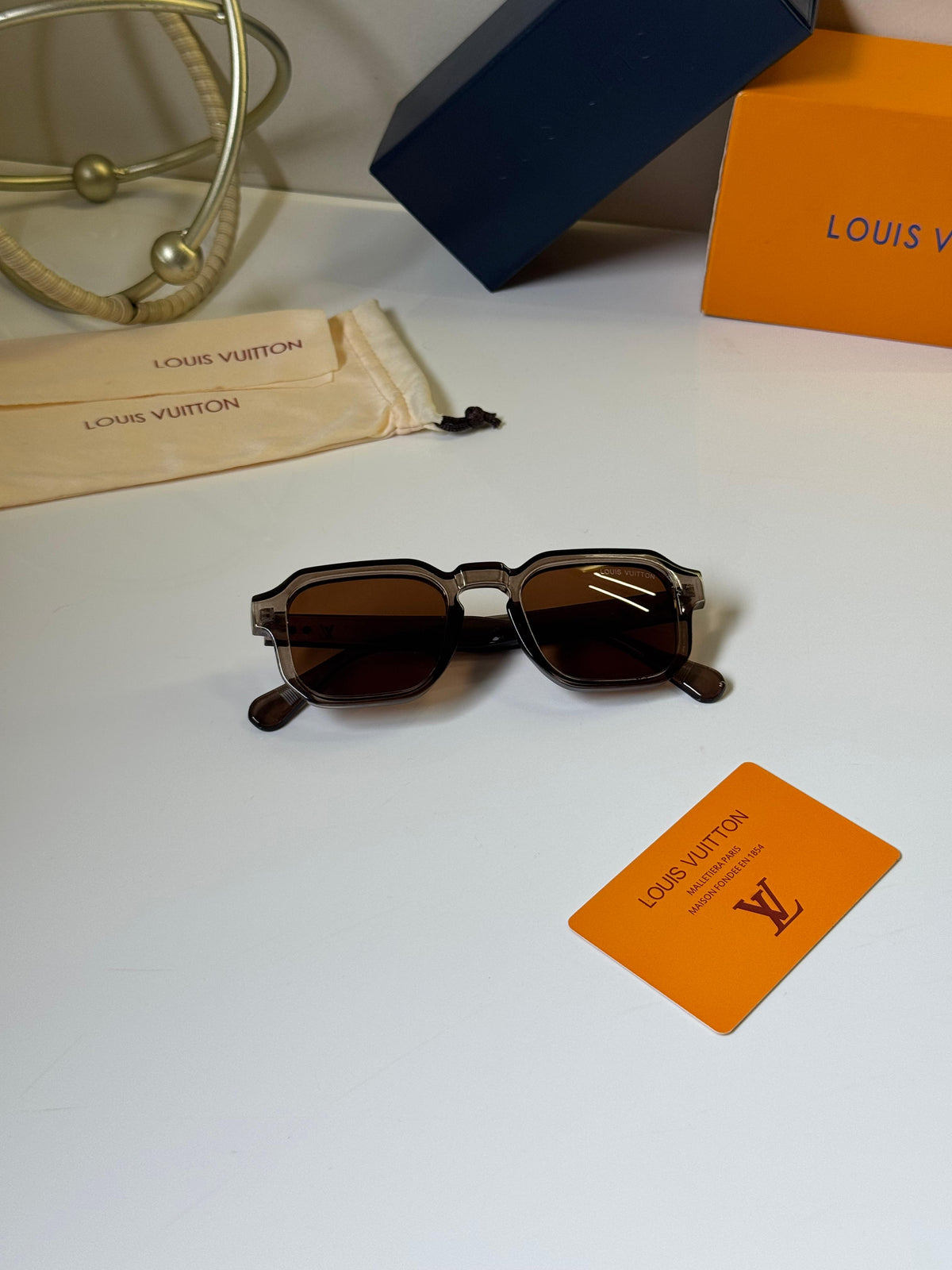 Louis Vuitton square translucent grey frames and warm brown-tinted lenses Women sunglasses