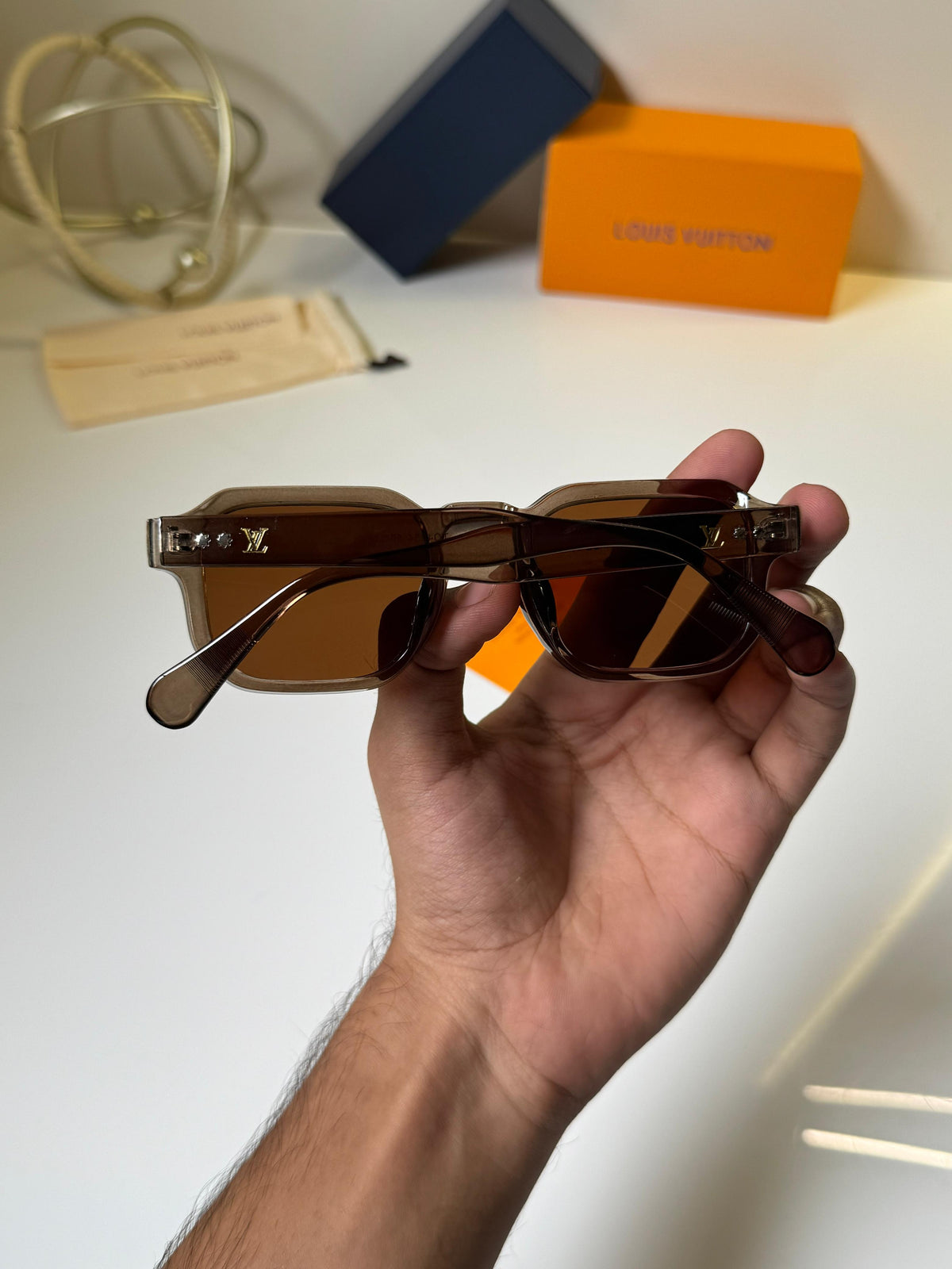 Louis Vuitton square translucent grey frames and warm brown-tinted lenses Women sunglasses